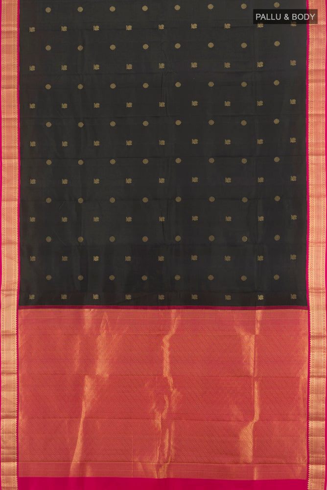 Flat view of Black Kanchipuram Silk Saree with Zari Butta on the body and Silk Border. 