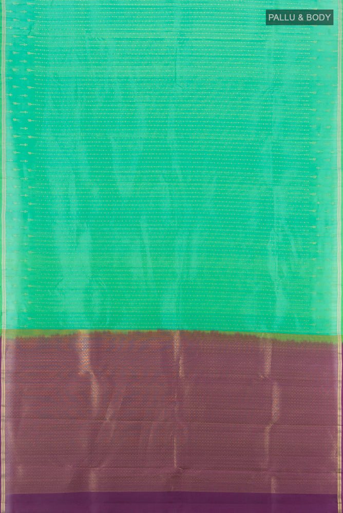 Flat view of Light Green Kanchipuram Silk Saree with Zari Butta on the body and Silk Border. 