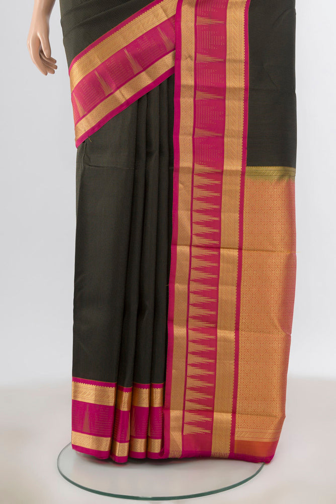 Pleats and pallu of Black Kanjivaram Silk Saree with Zari Butta on the body and Silk Border. 