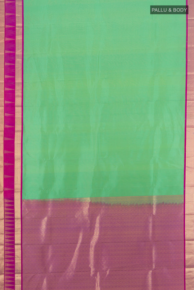 Flat view of Light Green Kanjivaram Silk Saree with Zari Butta on the body and Silk Border. 