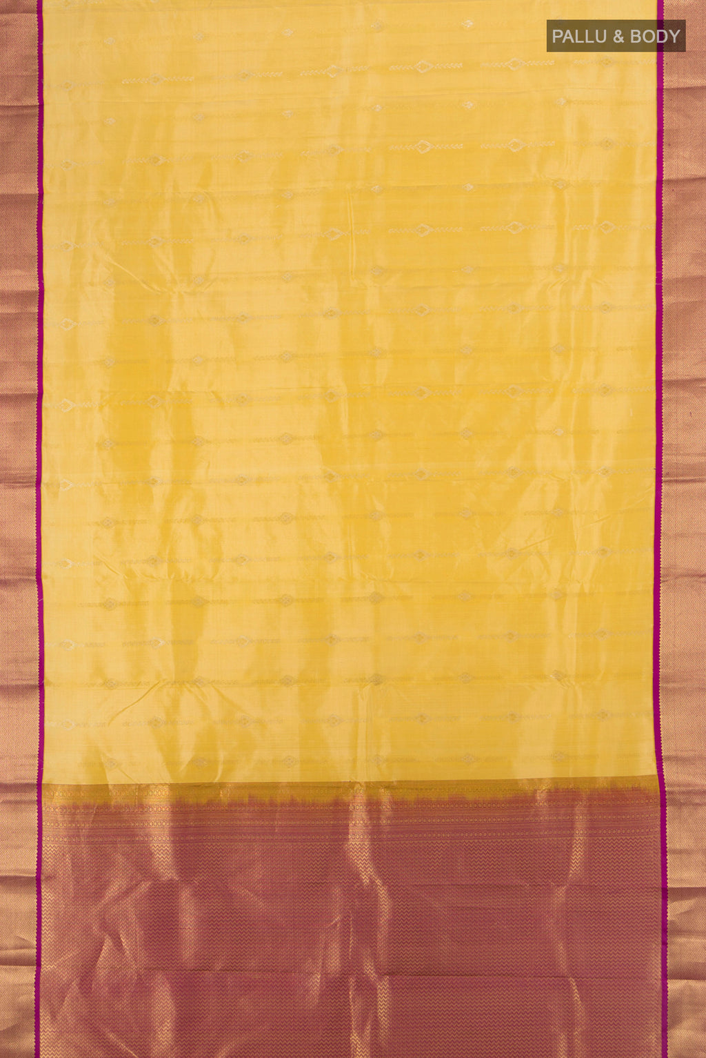 Flat view of Yellow Kanchipuram Silk Saree with Zari Butta on the body and Zari Border. 