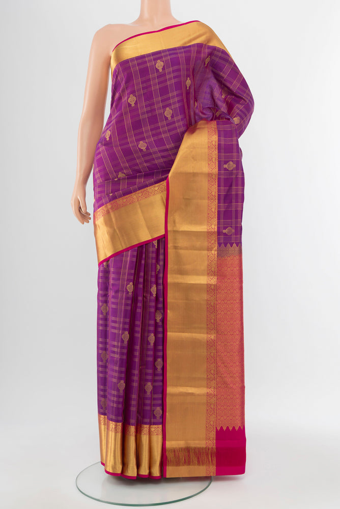 Purple Kanjivaram Silk Saree with Zari Butta on the body and Silk Border.  displayed on a mannequin