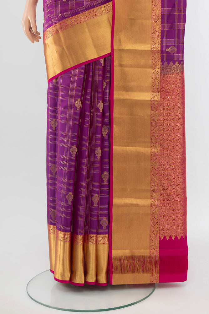 Pleats and pallu of Purple Kanjivaram Silk Saree with Zari Butta on the body and Silk Border. 