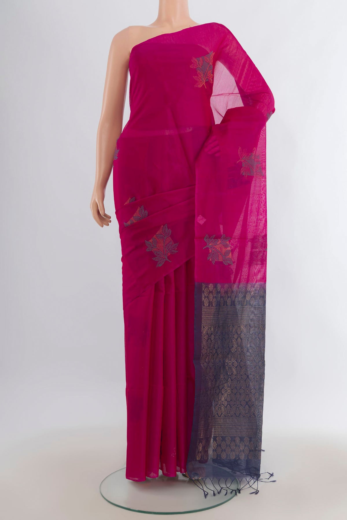 Pink Silk Cotton Saree with Thread Butta on the body and Without Border.  displayed on a mannequin