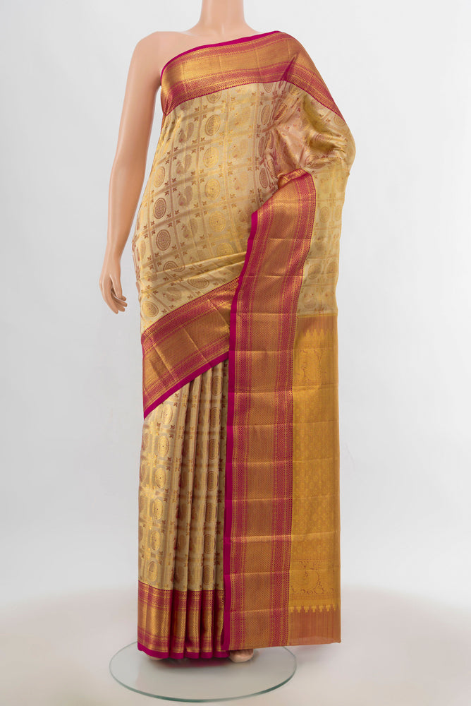 Golden Kanjivaram Silk Saree with Zari Butta on the body and Silk Border.  displayed on a mannequin