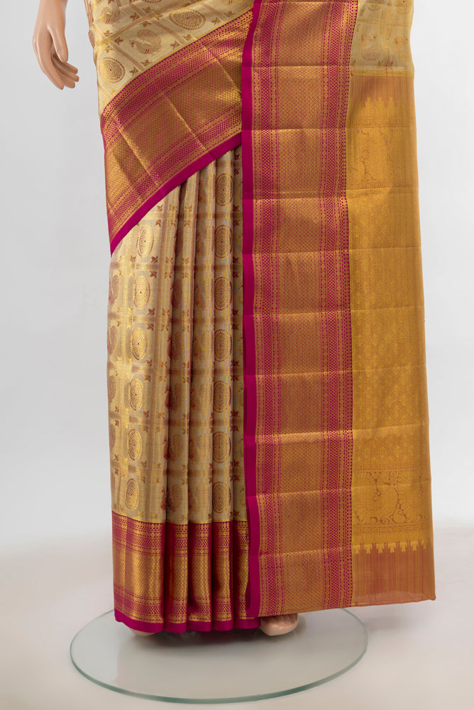 Pleats and pallu of Golden Kanjivaram Silk Saree with Zari Butta on the body and Silk Border. 