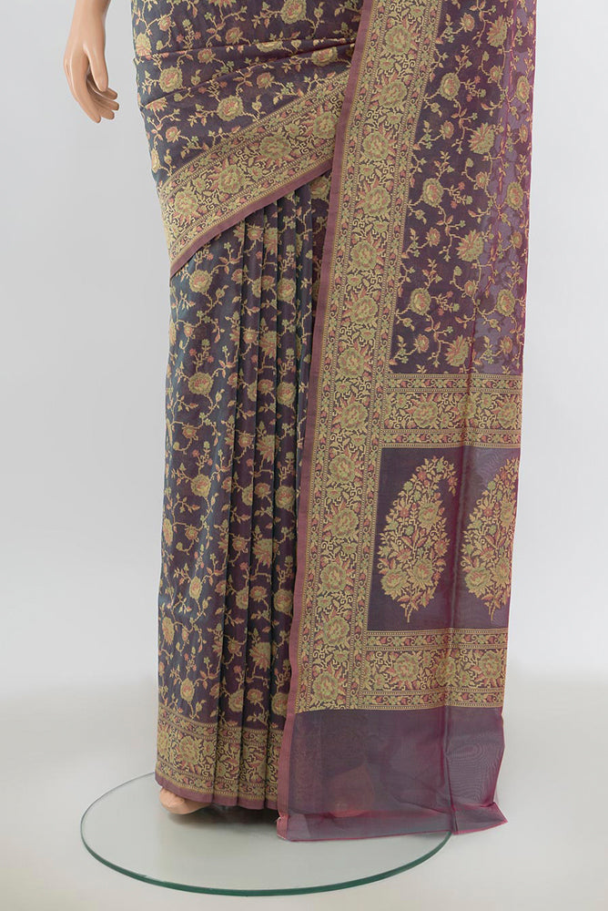 Pleats and pallu of Olive Green Banarasi Georgette Saree with Zari Butta on the body and Silk Border. 