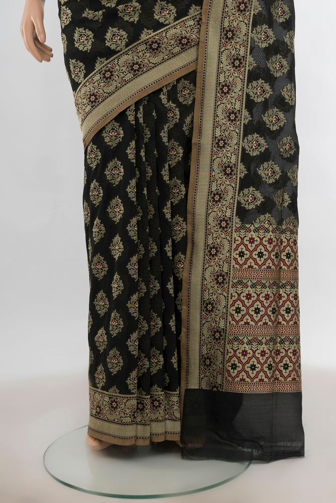 Pleats and pallu of Black Banarasi Silk Saree with Zari Butta on the body and Silk Border. 