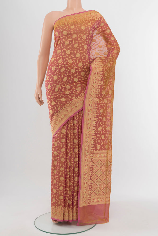 Peach Banarasi Georgette Saree with Zari Brocade on the body and Silk Border.  displayed on a mannequin