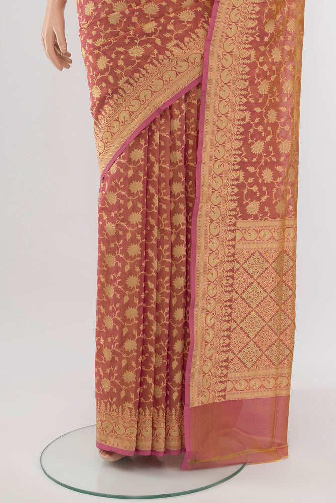 Pleats and pallu of Peach Banarasi Georgette Saree with Zari Brocade on the body and Silk Border. 