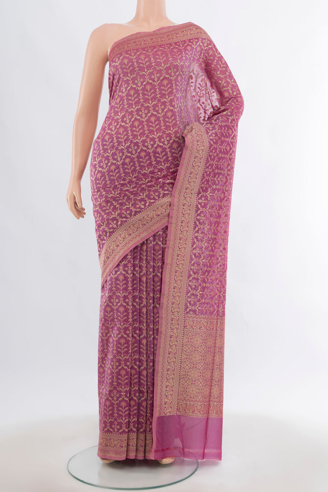 Golden Peach Banarasi Silk Saree with Zari Butta on the body and Silk Border.  displayed on a mannequin