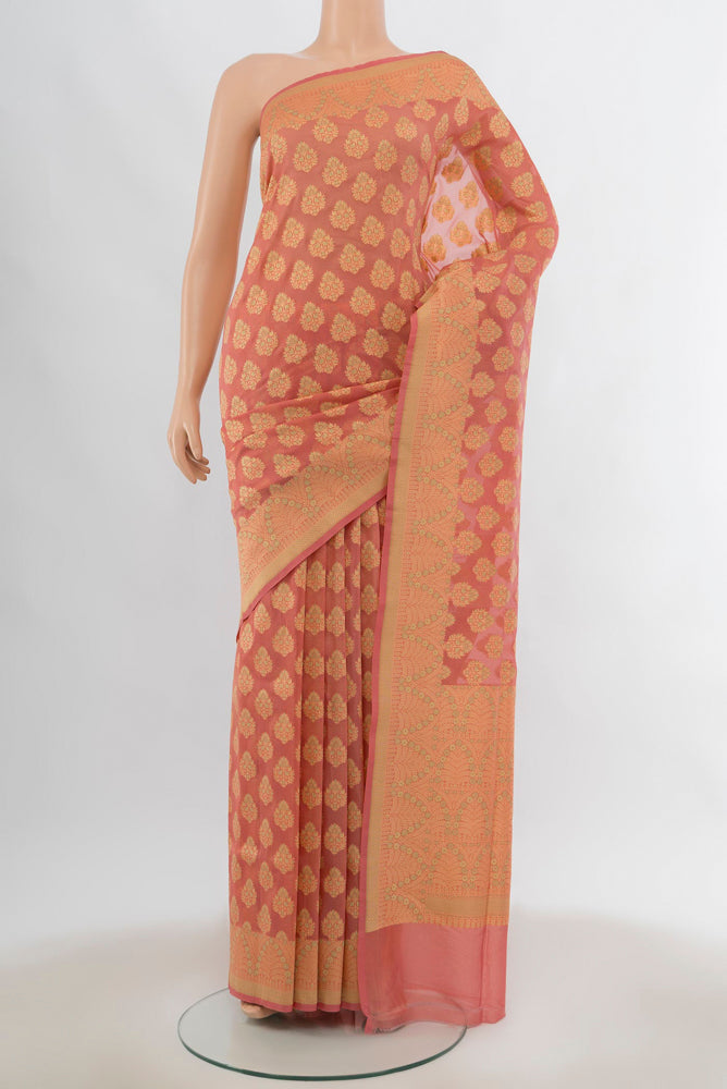 Peach Banarasi Silk Saree with Zari Butta on the body and Silk Border.  displayed on a mannequin