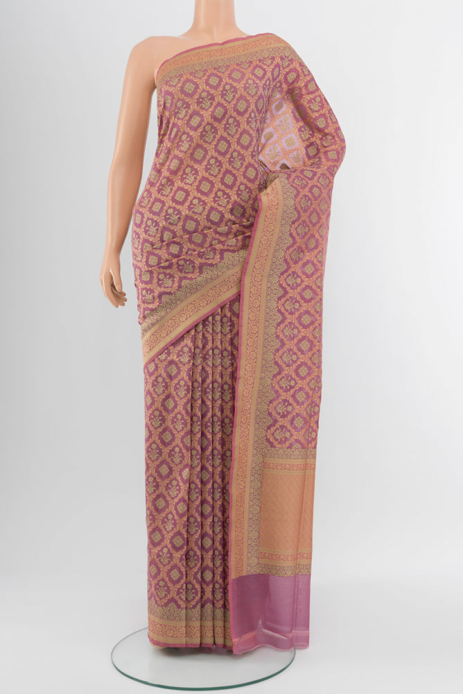 Bronze Banarasi Georgette Saree with Zari Brocade on the body and Silk Border.  displayed on a mannequin