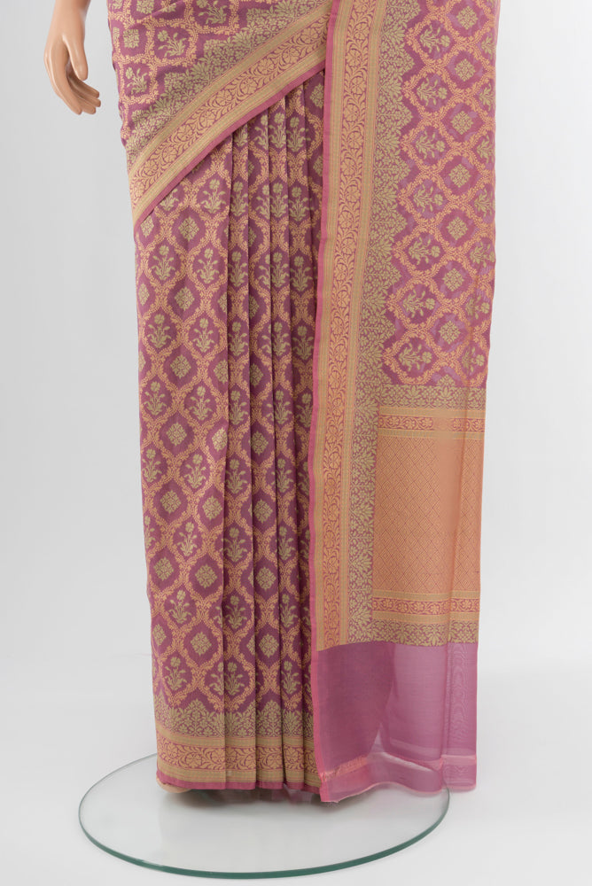 Pleats and pallu of Bronze Banarasi Georgette Saree with Zari Brocade on the body and Silk Border. 