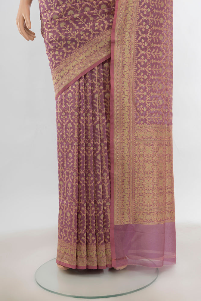 Pleats and pallu of Peach Banarasi Silk Saree with Zari Butta on the body and Silk Border. 