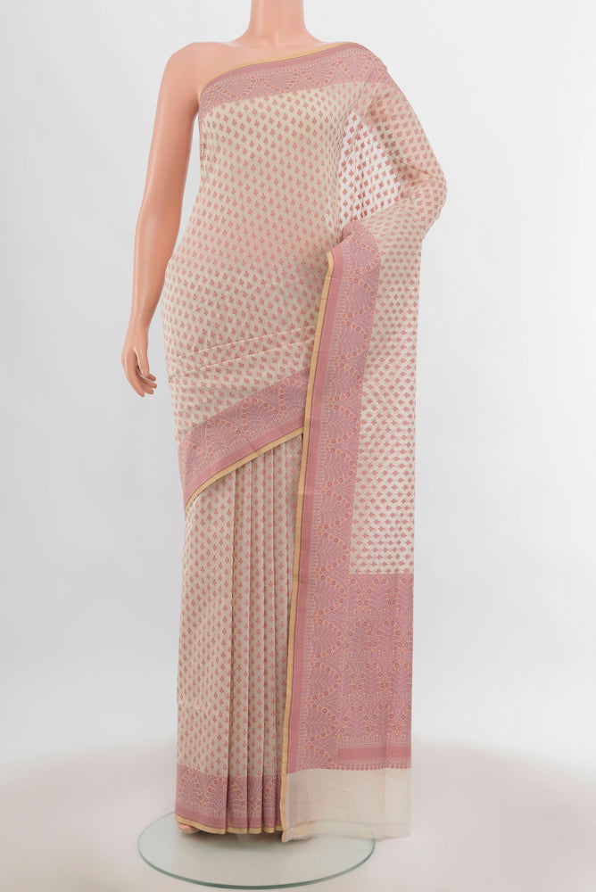 Cream Banarasi Silk Saree with Zari Butta on the body and Silk Border.  displayed on a mannequin