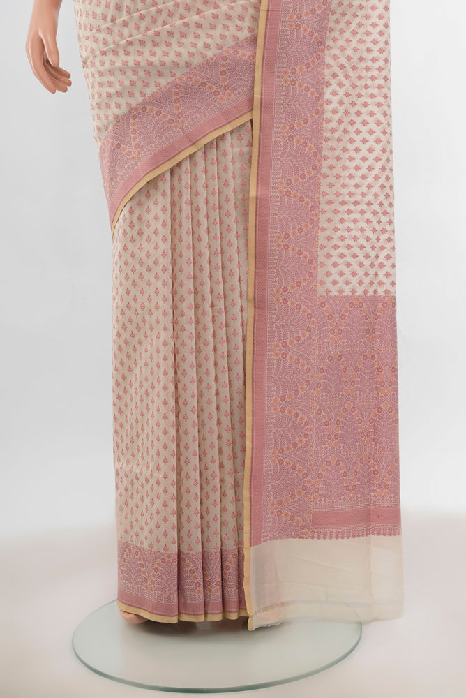 Pleats and pallu of Cream Banarasi Silk Saree with Zari Butta on the body and Silk Border. 