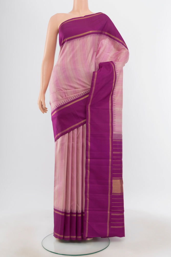Pure Silk Pure Zari Rose pink Kanjivaram Saree with Zari Butta on the body and Silk Border.  displayed on a mannequin