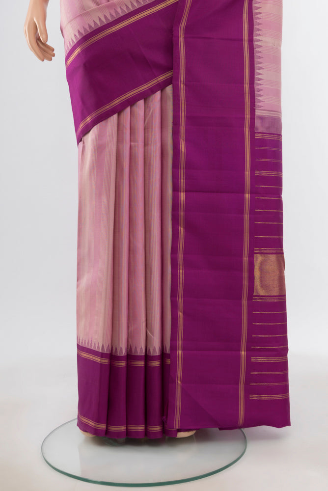 Pleats and pallu of Pure Silk Pure Zari Rose pink Kanjivaram Saree with Zari Butta on the body and Silk Border. 