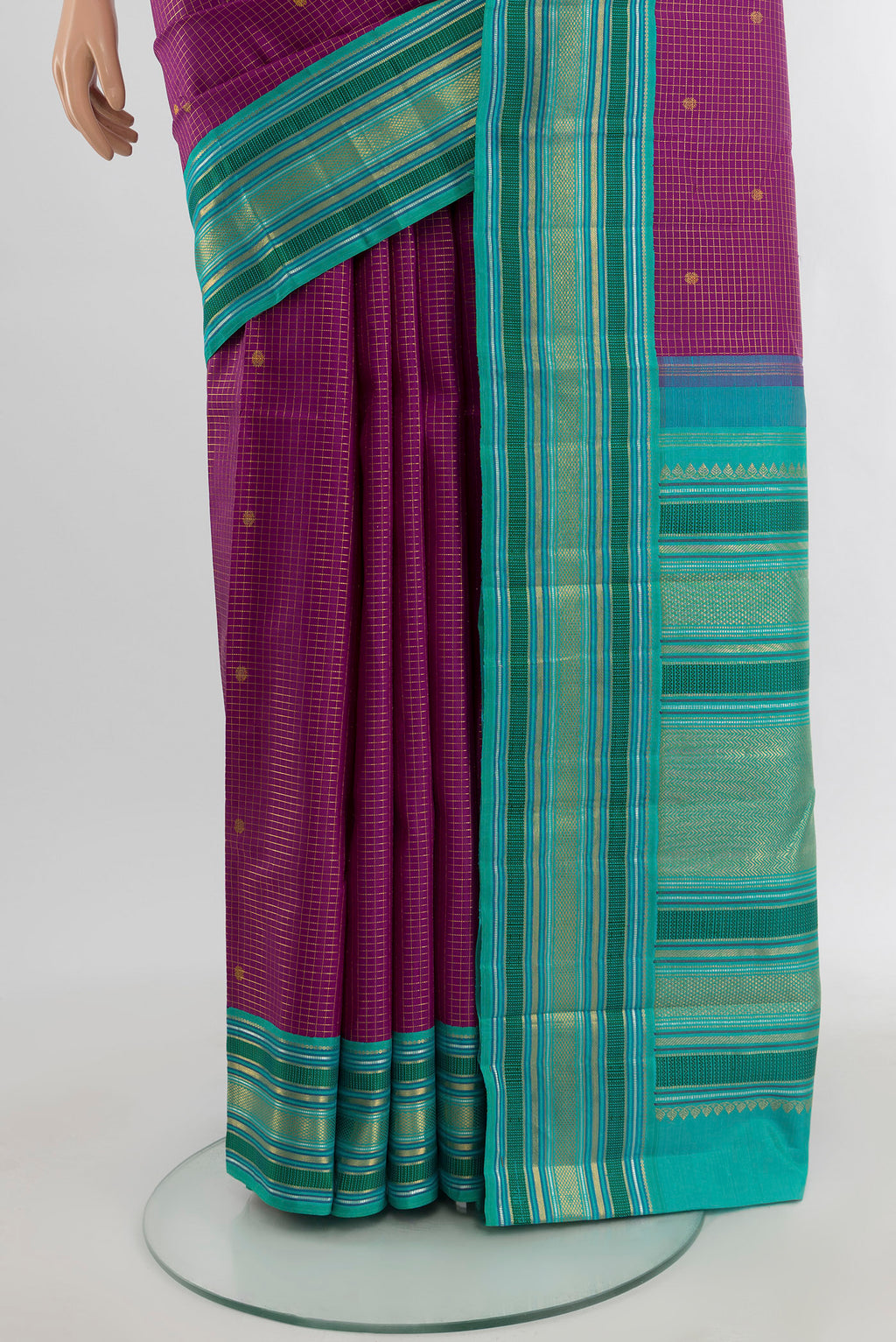 Pleats and pallu of Purple Kanchipuram Silk Saree with Checked design on the body and Zari Border. 