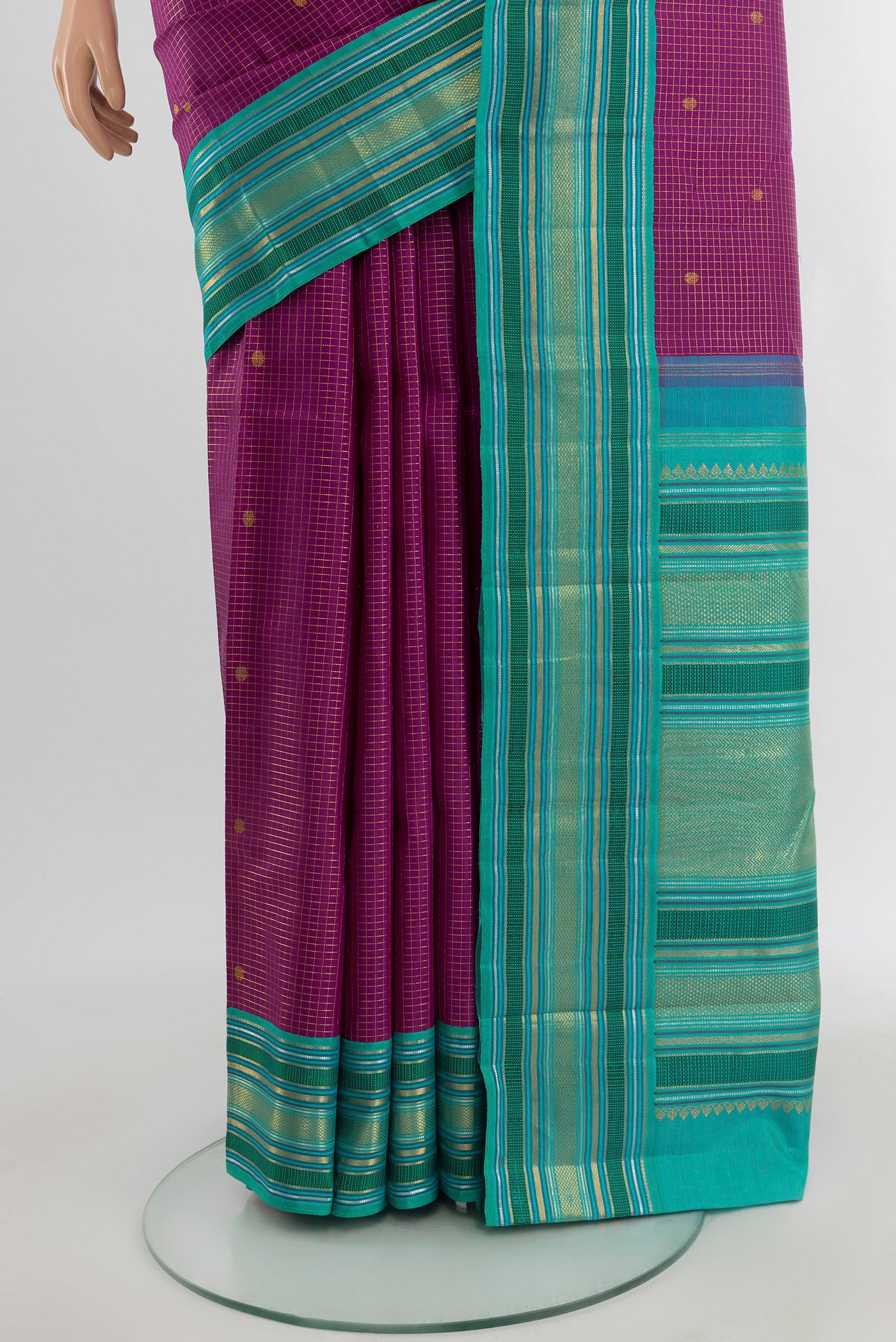 Pleats and pallu of Purple Kanchipuram Silk Saree with Checked design on the body and Zari Border. 