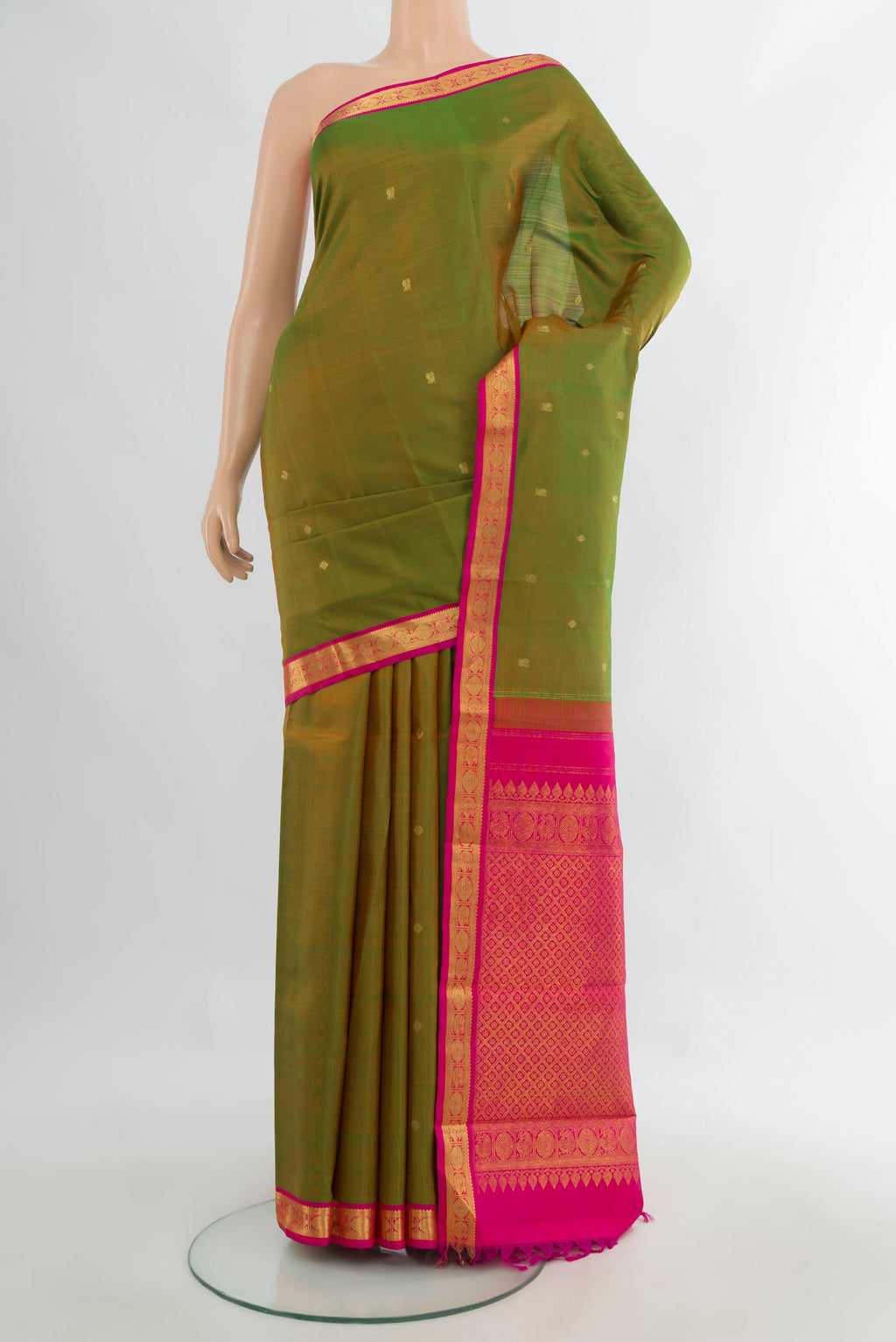 Pure Silk Green Kanchipuram Saree with Zari Butta on the body and Zari Border.  displayed on a mannequin