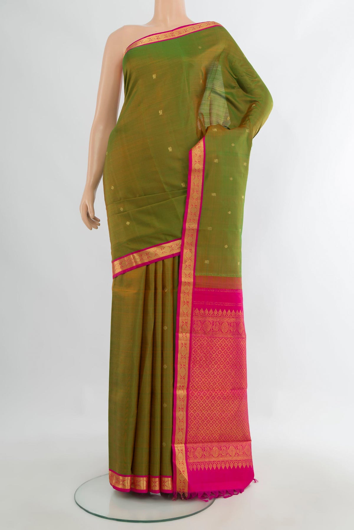 Pure Silk Green Kanchipuram Saree with Zari Butta on the body and Zari Border.  displayed on a mannequin