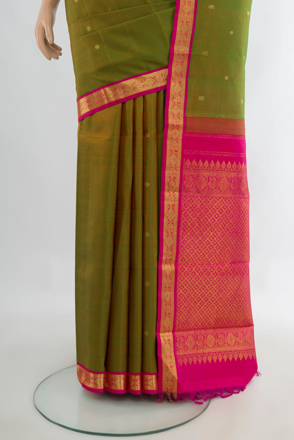 Pleats and pallu of Pure Silk Green Kanchipuram Saree with Zari Butta on the body and Zari Border. 