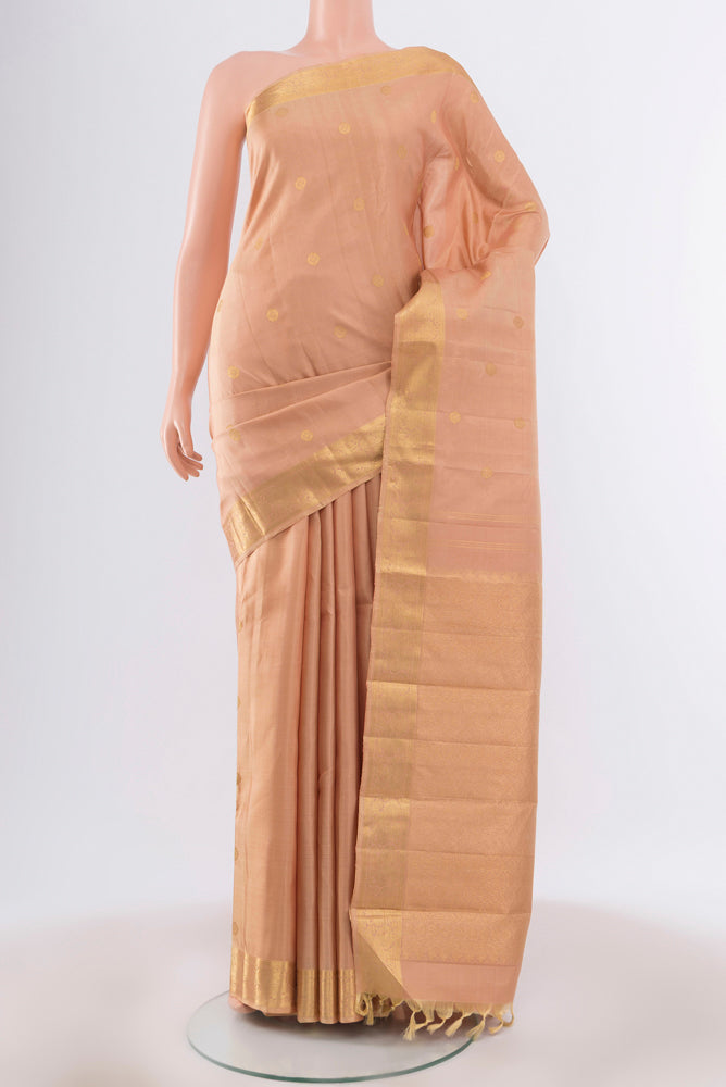 Pure Silk Pure Zari Dark Beige Kanchipuram Saree with Zari Butta on the body and Silk Border.  displayed on a mannequin