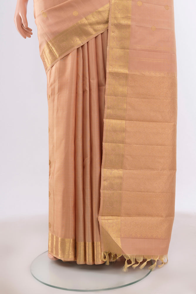 Pleats and pallu of Pure Silk Pure Zari Dark Beige Kanchipuram Saree with Zari Butta on the body and Silk Border. 