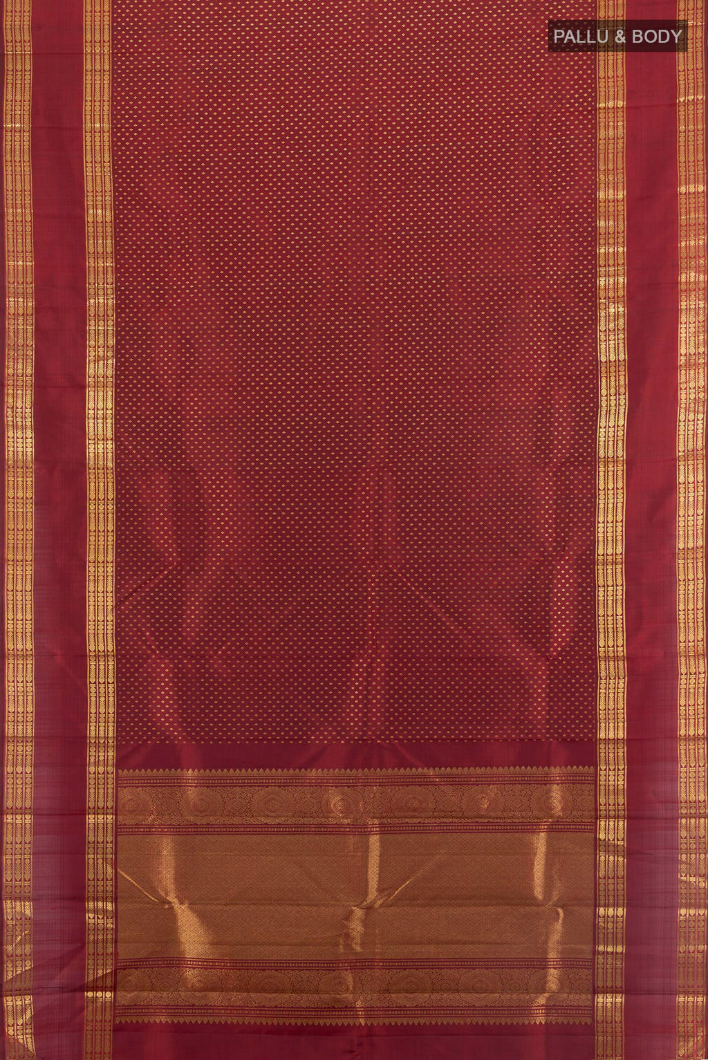 Flat view of Maroon Kanjivaram Silk Saree with Zari Butta on the body and Zari Border. 