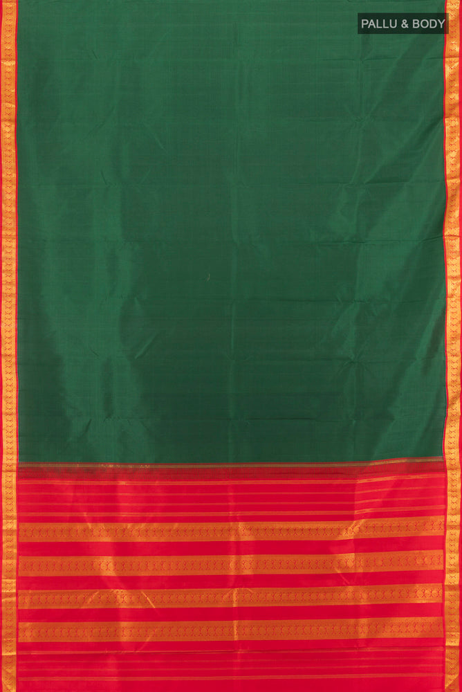 Flat view of Bottle Green Kanjivaram Silk Saree with Zari Butta on the body and Silk Border. 