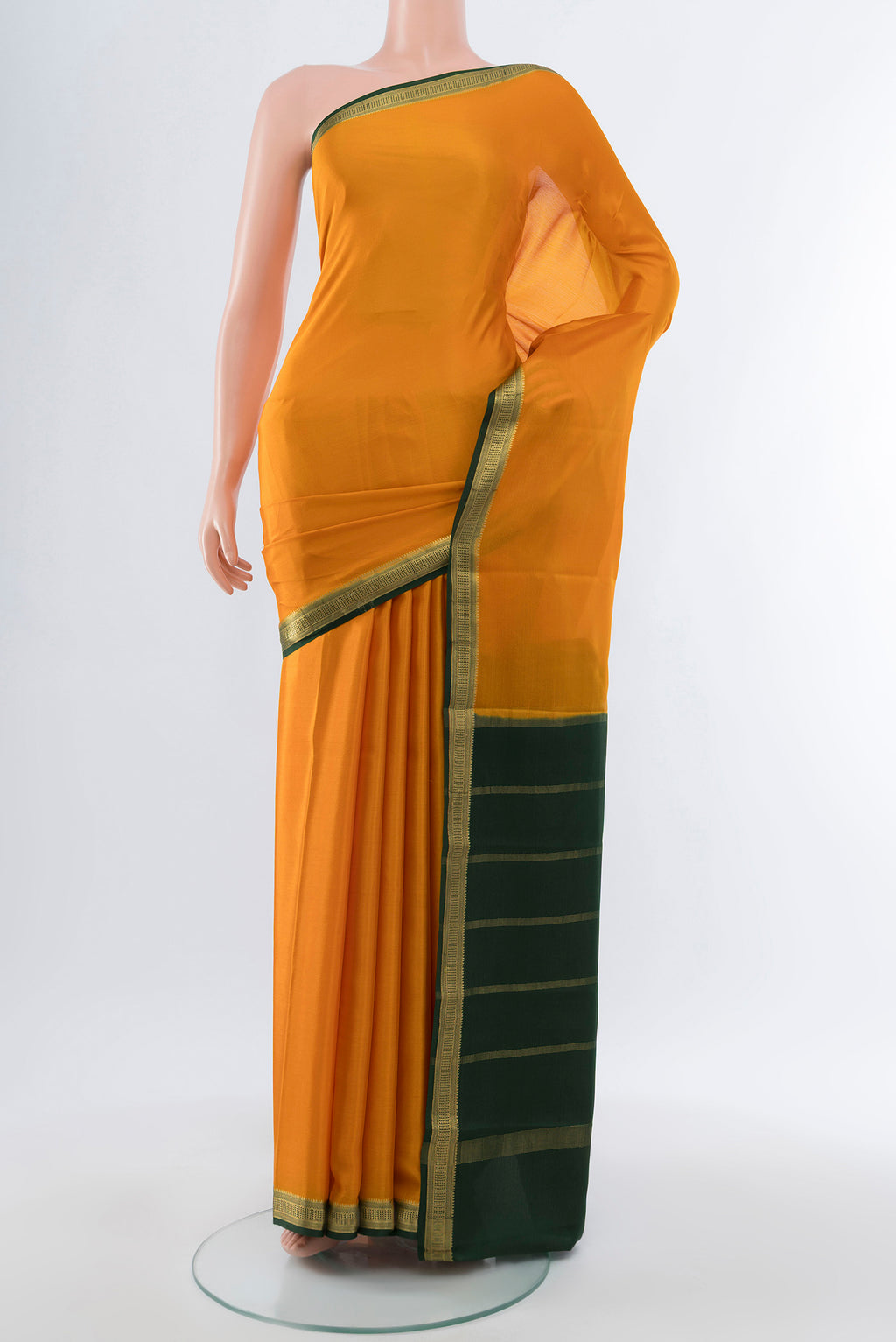 Mustard Mysore Crepe Saree with Plain Body and Silk Border.  displayed on a mannequin