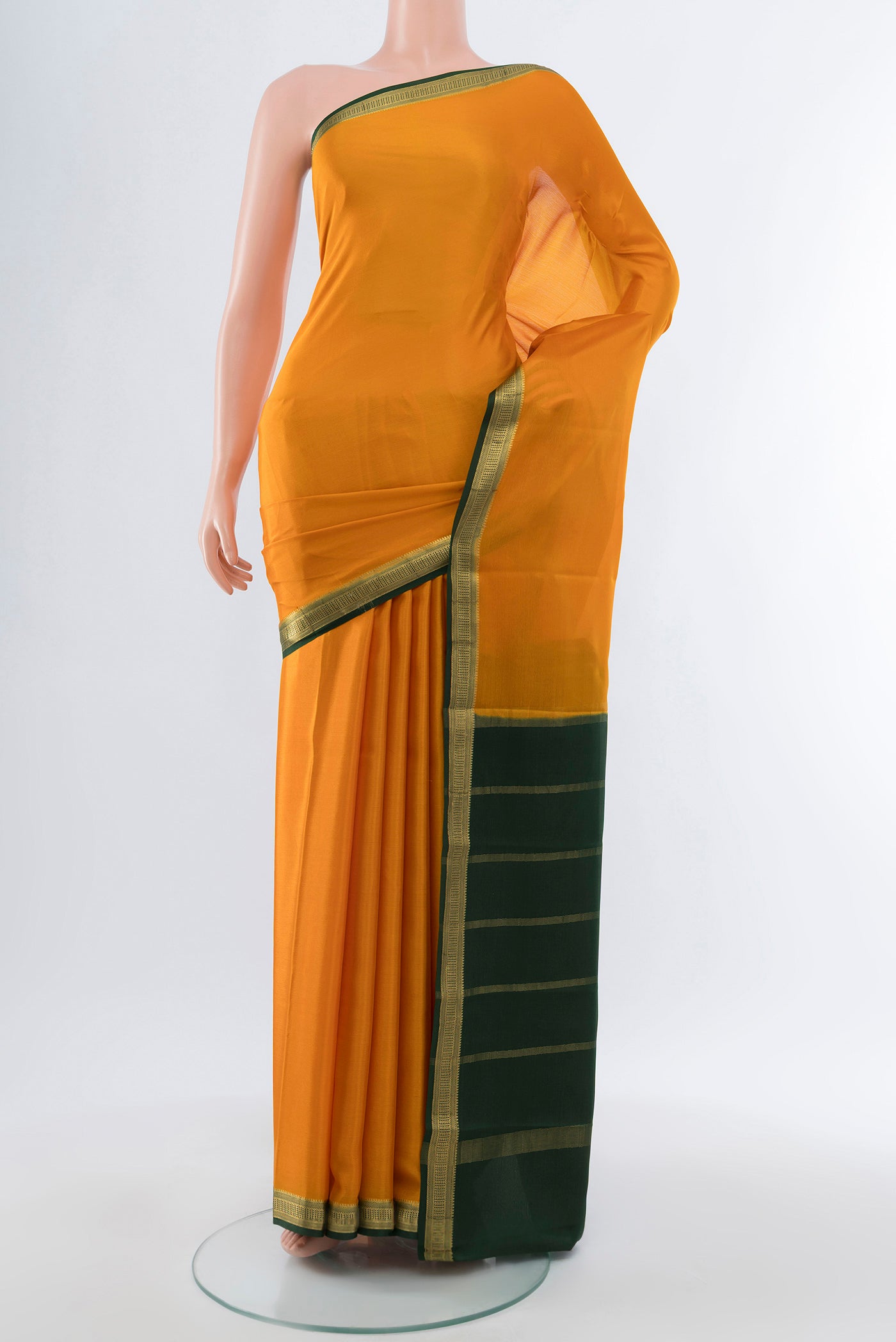 Mustard Mysore Crepe Saree with Plain Body and Silk Border.  displayed on a mannequin