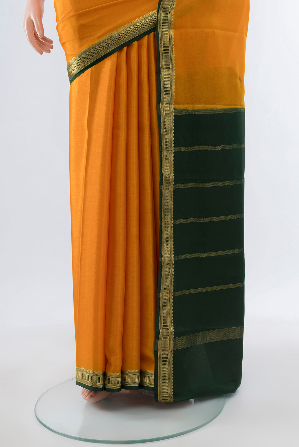 Pleats and pallu of Mustard Mysore Crepe Saree with Plain Body and Silk Border. 