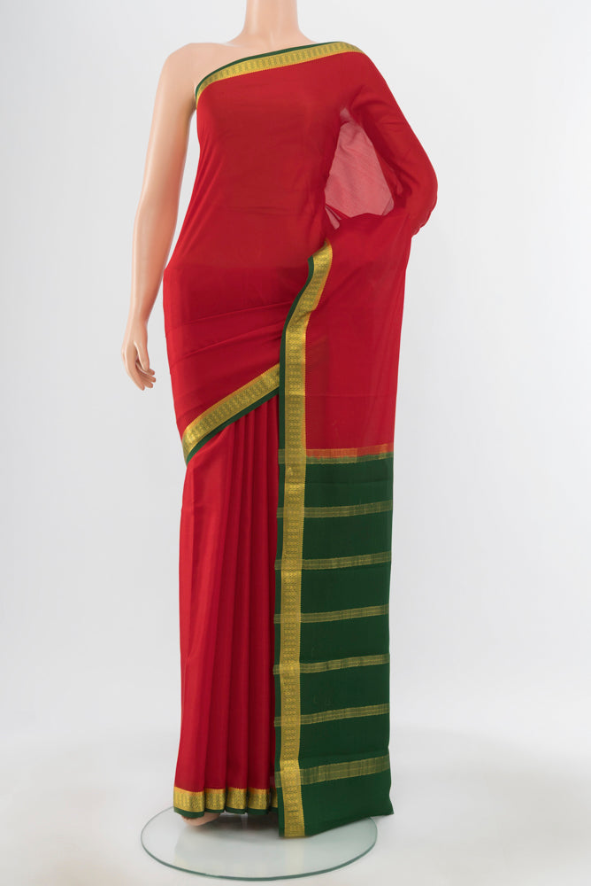Pure Silk Pure Zari Red Mysore Crepe Saree with Zari Butta on the body and Silk Border.  displayed on a mannequin