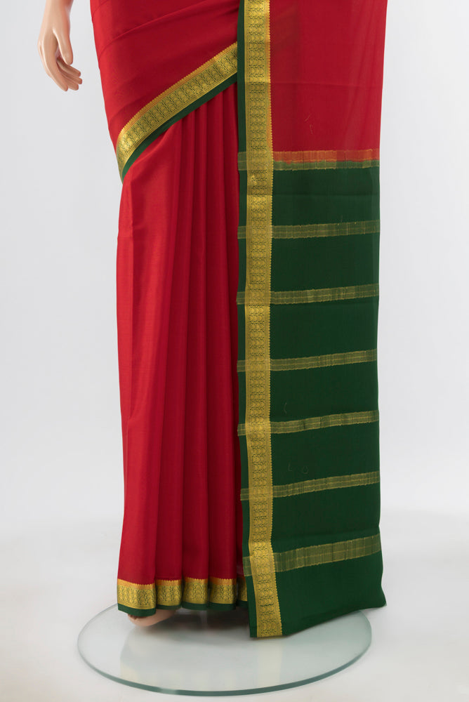 Pleats and pallu of Pure Silk Pure Zari Red Mysore Crepe Saree with Zari Butta on the body and Silk Border. 