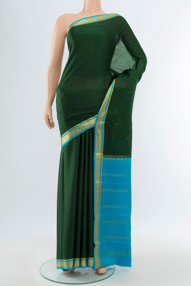 Bottle Green Mysore Crepe Saree with Plain Body and Silk Border.  displayed on a mannequin