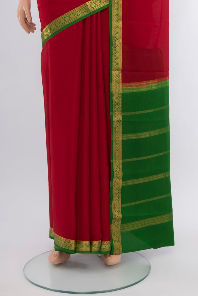 Pleats and pallu of Red Mysore Crepe Saree with Zari Butta on the body and Silk Border. 