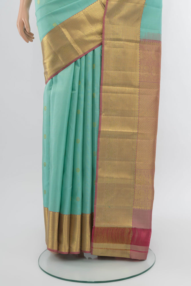 Pleats and pallu of Sky Blue Kanchipuram Silk Saree with Zari Butta on the body and Silk Border. 