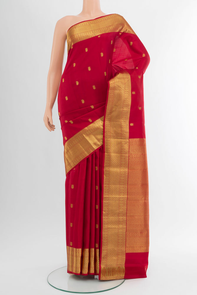 Pure Silk Pure Zari Maroon Kanchipuram Saree with Zari Butta on the body and Silk Border.  displayed on a mannequin