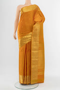 Mustard Kanchipuram Silk Saree with Zari Butta on the body and Silk Border.  displayed on a mannequin