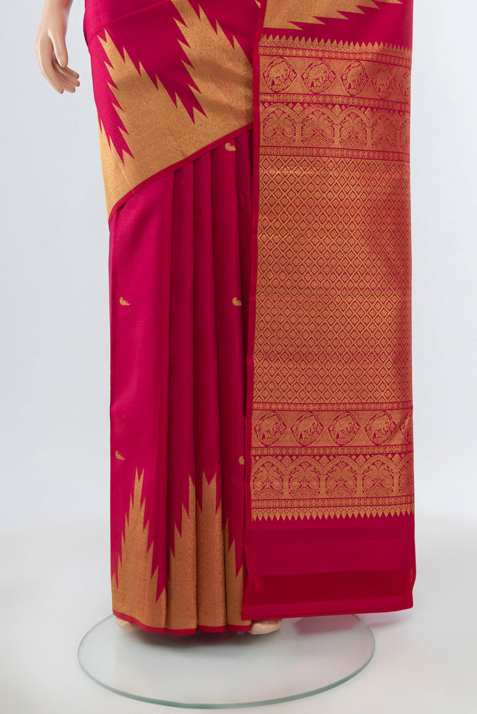 Pleats and pallu of Maroon Kanjivaram Silk Saree with Zari Butta on the body and Silk Border. 