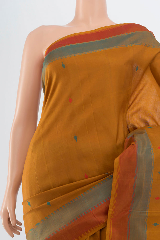 Border image of Brown Kanchipuram Silk Saree with Zari Butta on the body and Silk Border. 