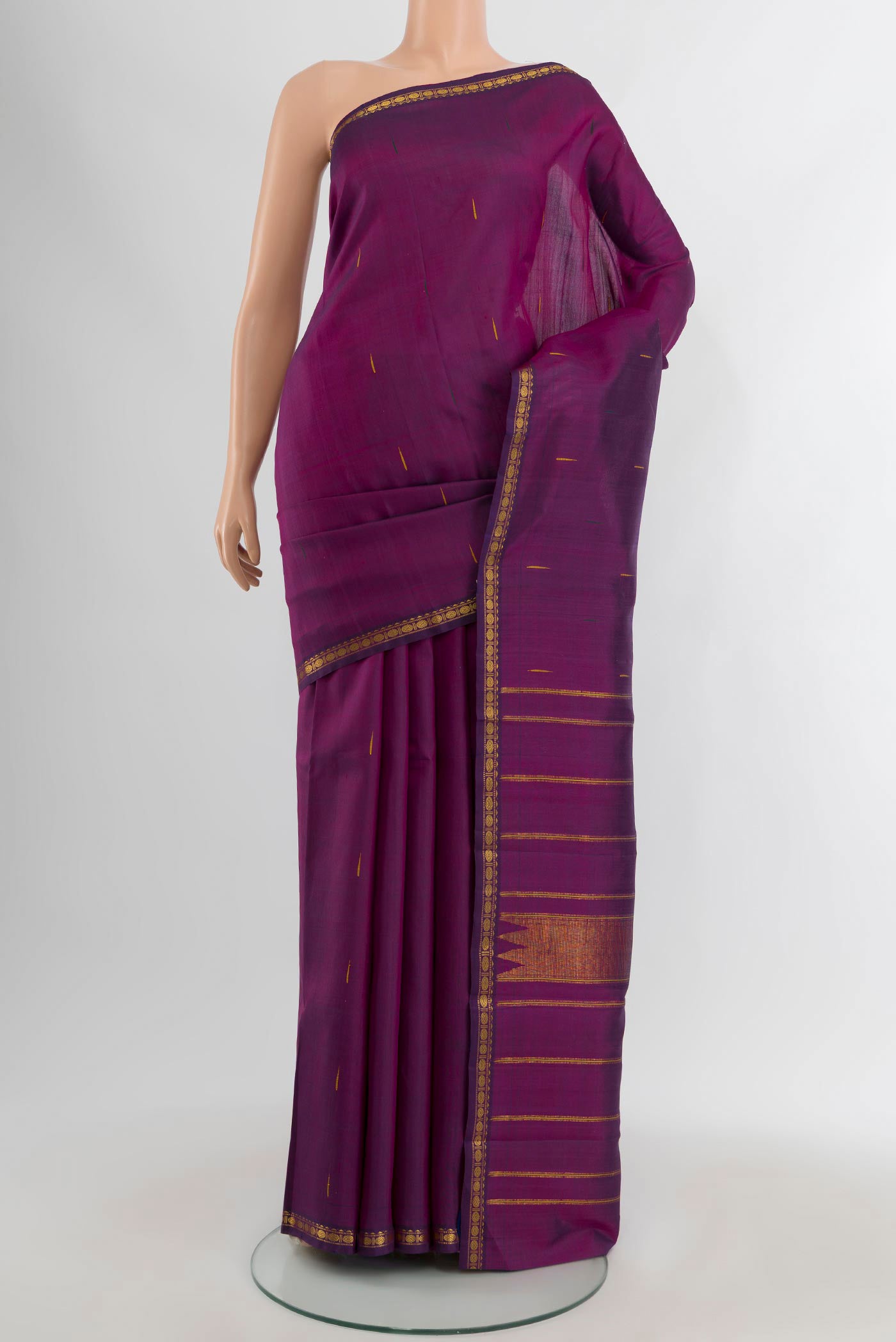 Purple Kanchipuram Silk Saree with Zari Butta on the body and Zari Border.  displayed on a mannequin