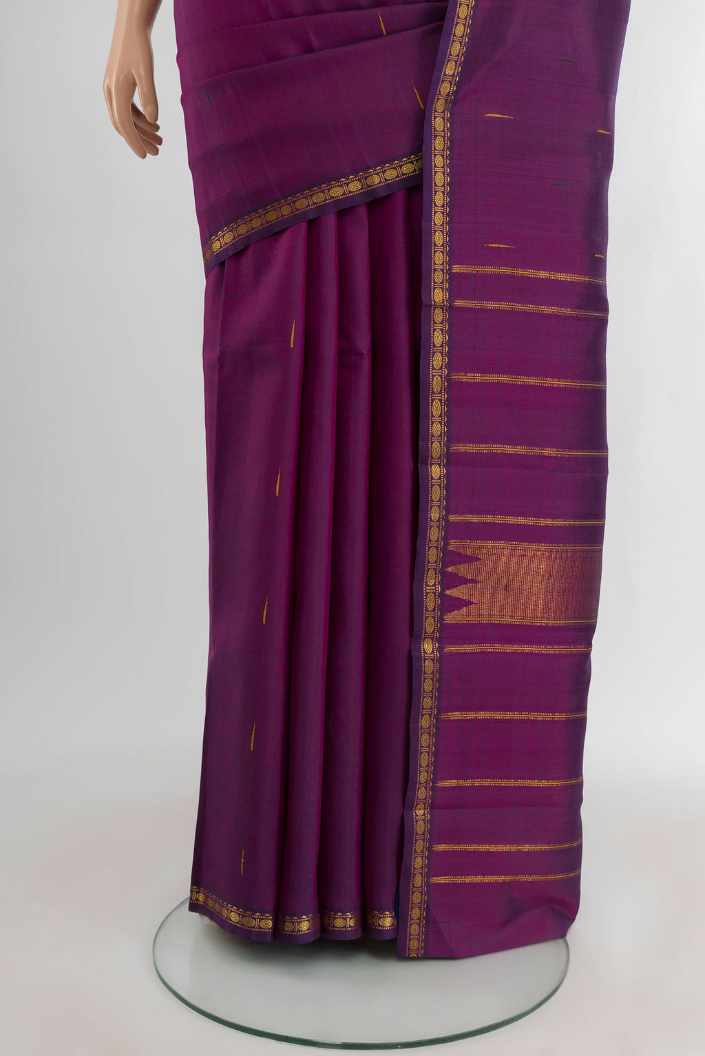 Pleats and pallu of Purple Kanchipuram Silk Saree with Zari Butta on the body and Zari Border. 