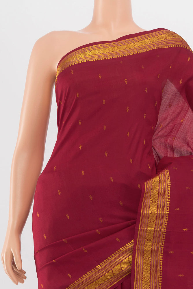 Border image of Maroon Kanchipuram Silk Saree with Zari Butta on the body and Silk Border. 