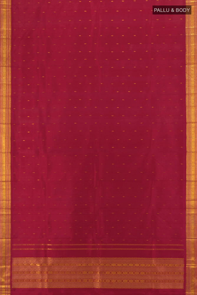 Flat view of Maroon Kanchipuram Silk Saree with Zari Butta on the body and Silk Border. 