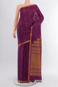 Purple Kanjivaram Silk Saree with Zari Butta on the body and Zari Border.  displayed on a mannequin