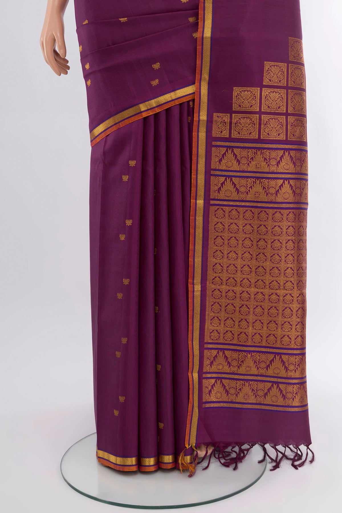 Pleats and pallu of Purple Kanjivaram Silk Saree with Zari Butta on the body and Zari Border. 